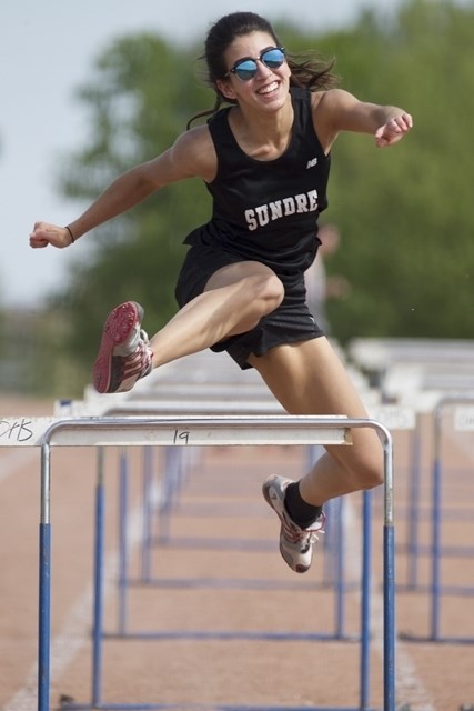 HIGH SCHOOL TRACK MEET — Sundre High School Grade 12 student Claudia Mennear competes in the 80 metre hurdles event at the Chinook&#8217;s Edge South Athletic Association