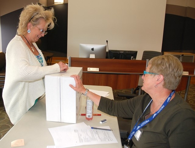 LOCAL DEMOCRACY IN ACTION — Sundre resident Moe Fahey casts a ballot during the advanced poll in the local byelection last Tuesday, June 14, following the recent resignation