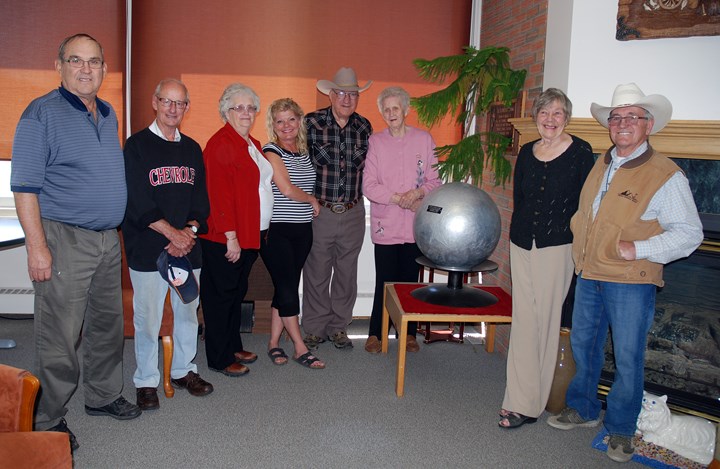 MUSEUM WELCOMES UNIQUE DONATION — A rather large aluminum silver ball rolled up from innumerable cigarette package foils over the span of more than 30 years was recently
