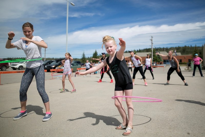 Kendra Ross, left, and Dylan Smith show off their hula hoop skills during a Dance Fitness and Yoga Fundraiser for the Sundre Aquaplex on Saturday, June 18 at the