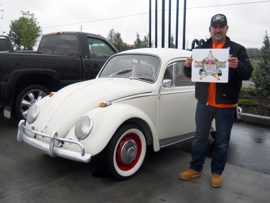 SUPPORTING SUICIDE AWARENESS &#8211; Organizer Dana Munn stands beside a vintage Volkswagen Beetle during the Sundre stopover of the July 16 Suicide Awareness Cruze. The