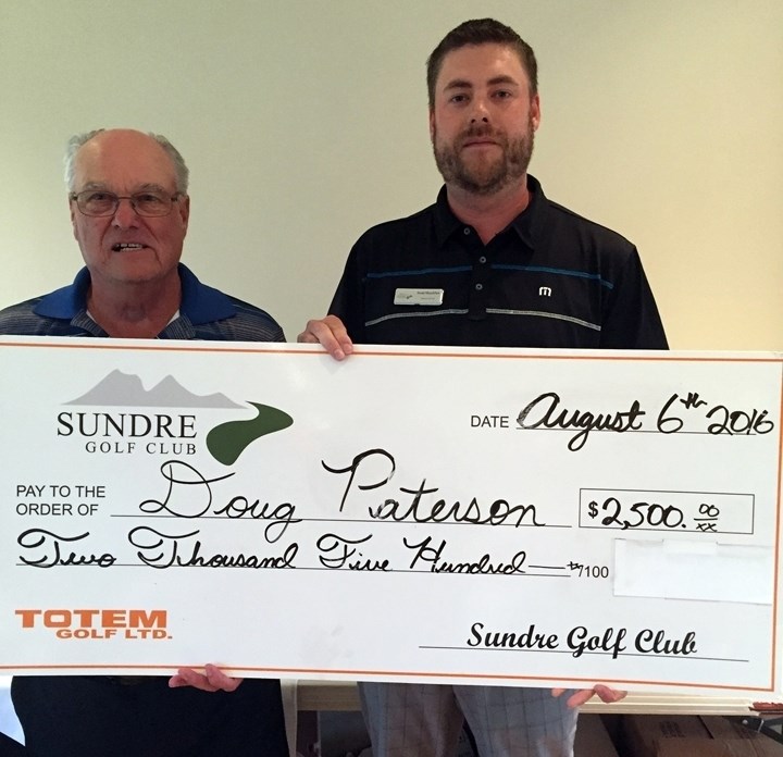 HOLE-IN-ONE — Doug Paterson, left, won $2,500 sponsored by the Sundre Golf Club after scoring a hole-in-one on Saturday, Aug. 6 during the sixth annual Suncreek Classic. The