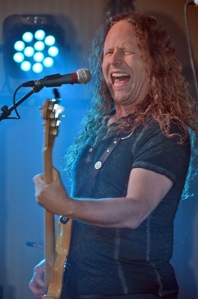 Bass player Kitty Chevelle, a member of the Chevelles, belts out some vocals while laying down the bass line during one of the band&#8217;s performances for the Sundre