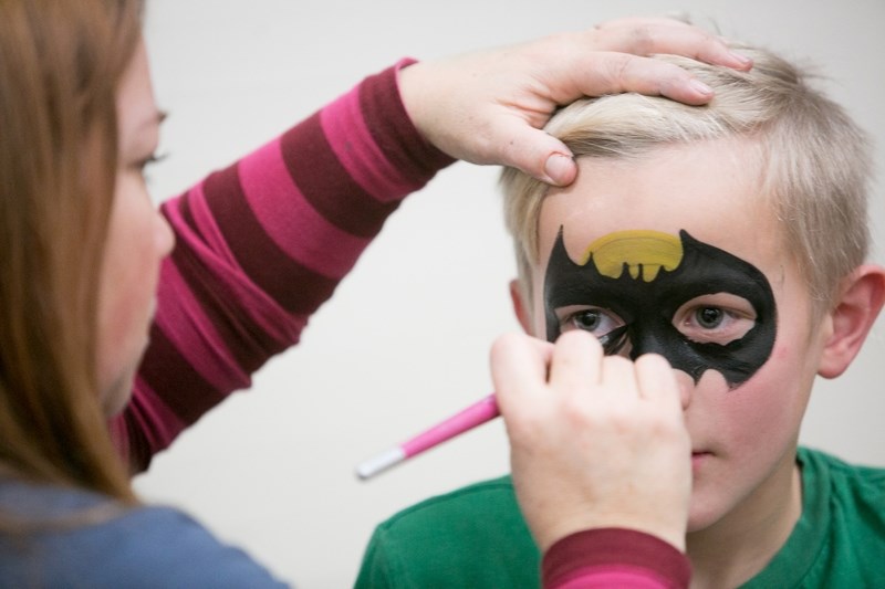 AJ Davidson gets his face painted during Sundown in Sundre festivities at the community centre Dec. 2.,