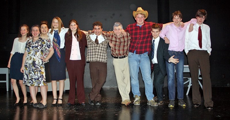 The Sundre High School Drama Club&#8217;s cast, which recently performed a play called Office Hours, is pictured in costume on the stage at the Sundre Arts Centre.
