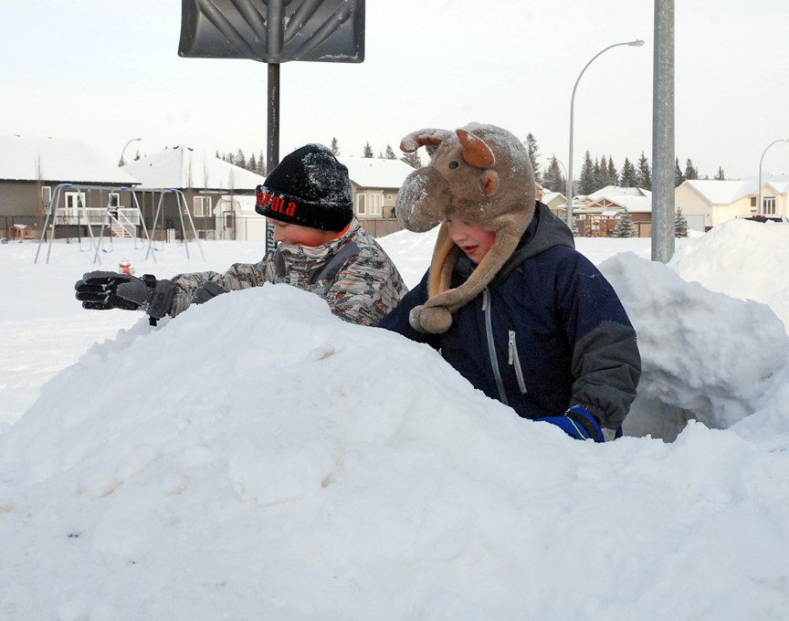 Brothers Dyllan, 7, left, and Russell Marko, 9, did not seem to mind all the snow that has continued to come down this month. They&#8217;re pictured here in Sundre&#8217;s