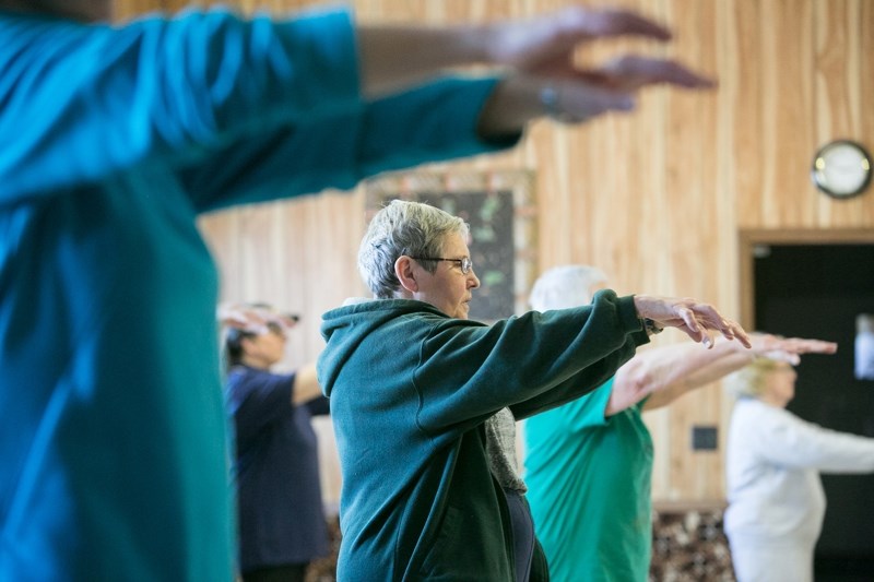 Resgistrants take part in a Tai Chi class at the McDougal Flats Community Hall on March 7.