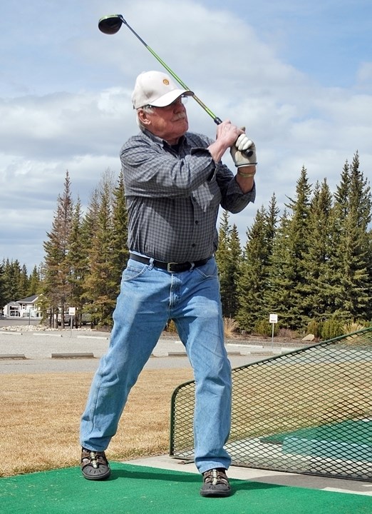 Carl Arnold, a Sundre resident of more than 10 years, tracks a golf ball last week at the Coyote Creek Golf and RV Resort&#8217;s driving range. The course opens this week.