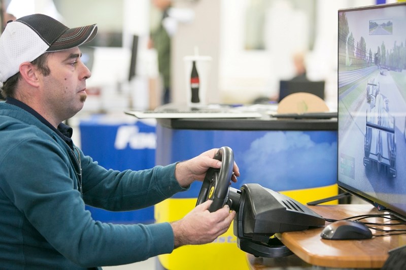 Sundre Fountain Tire owner Todd Dalke tries out a driving simulator at his business&#8217;s booth during last year&#8217;s inaugural Explore Sundre Adventure and Home Expo.