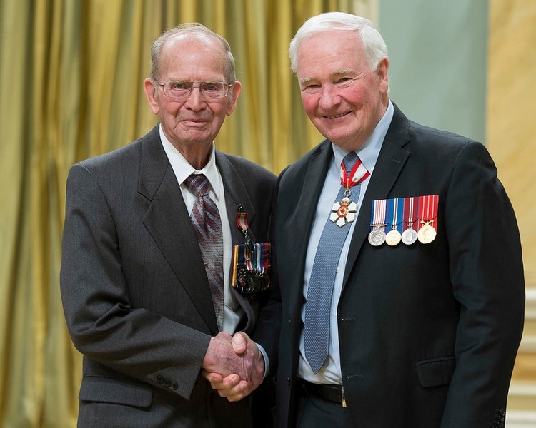 David Johnston, Governor General of Canada, presents Sundre-area resident Harvey Shevalier with the Sovereign&#8217;s Medal for Volunteers during a Monday, April 24 ceremony