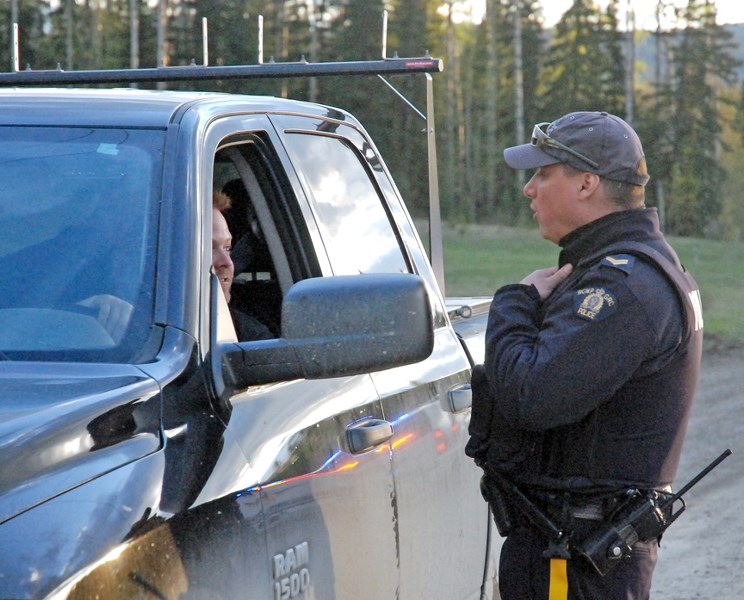 Cpl. Joe Mandel was among several officers at a check stop on Rig Street South engaging recreational land users who came through to enjoy the West Country for the May long