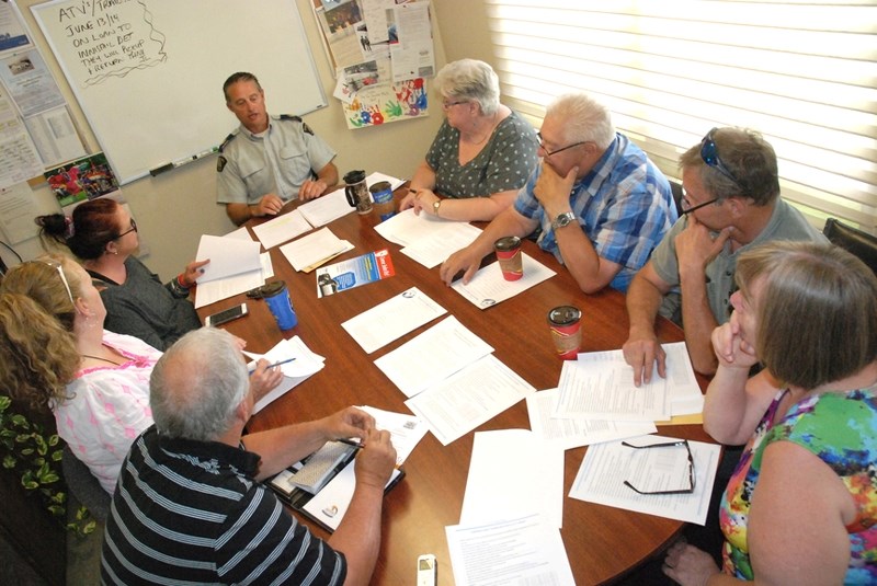 Sgt. Jim Lank, the Sundre RCMP detachment&#8217;s commander, recently outlines during a meeting with residents at the station the necessary steps required to revive a local