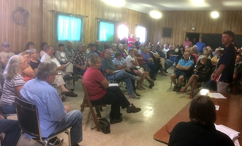 The McDougal Flats Community Hall was packed with more than 100 people on the evening of Tuesday, Aug. 15 during a public meeting organized by the South McDougal Flats Area