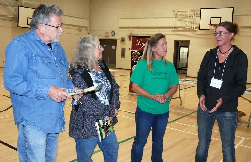 From left, Joe VanWeenen and his wife Barb, who live in Sundre and also own a recreational property just west of town, chat with Tammy Mather, executive director of the