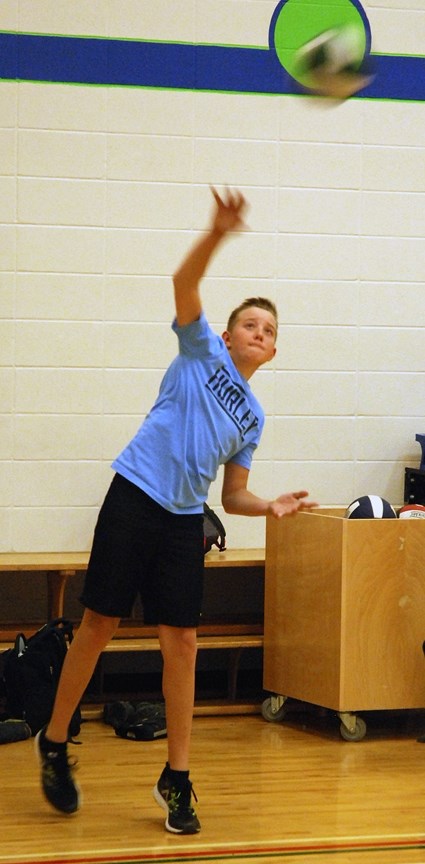 River Valley School Grade 8 student Kaiden Vennard serves during a recent volleyball practice. Coach Sonja Logan told the Round Up the season to date has gone well, and that