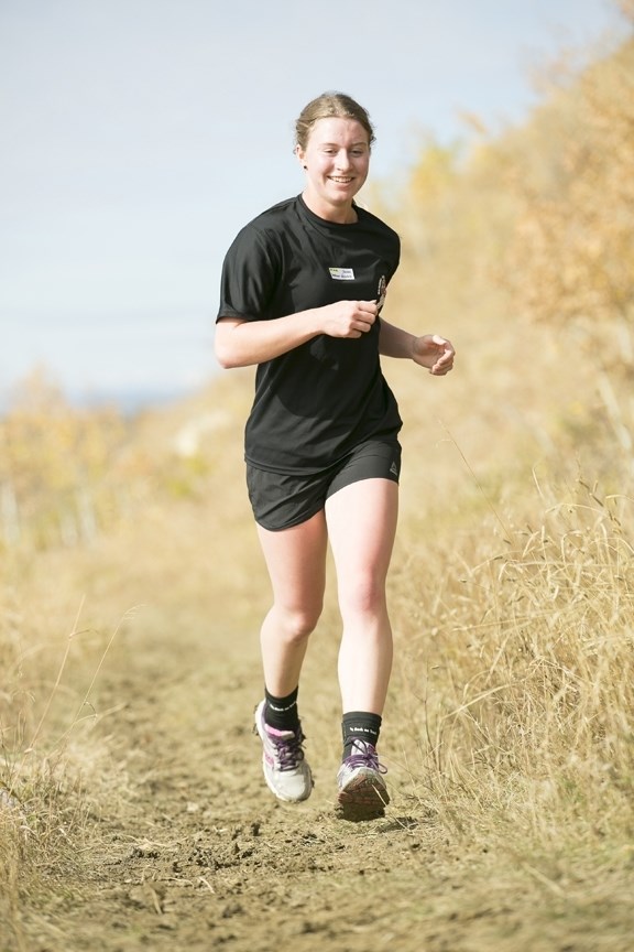 Sundre High School student Deshann Valentine runs along Snake Hill during the senior girls&#8217; heat at a cross-country meet in Sundre on Oct. 4. Valentine finished first