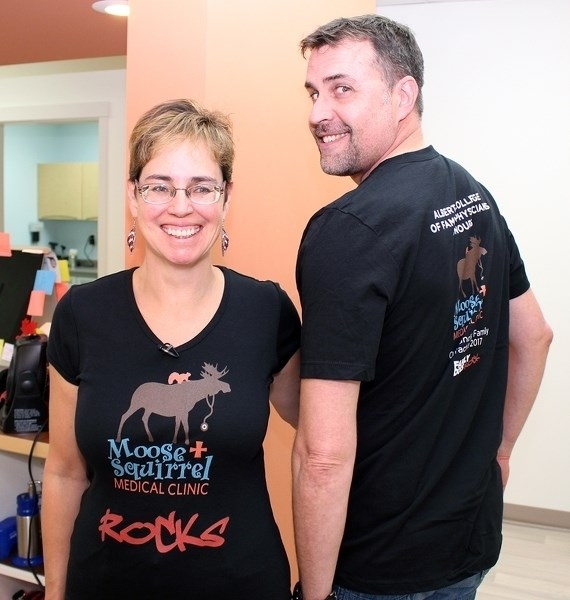 Calgary doctor Joan Horton, chair of awards and recognition committee for the Alberta College of Family Physicians, chats with Sundre&#8217;s Dr. Rob Warren and Dr. Michelle