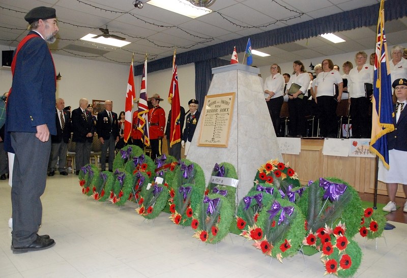 Sergeant at arms Jamie Moffat prepares to direct the colour guard to march out as the ceremony wrapped up during last year&#8217;s Remebrance Day service at the Sundre Legion 