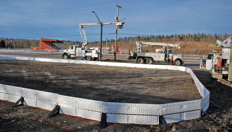 A Fortis crew was working last week to connect to the power grid new light posts installed at the site of the outdoor rink, located immediately next to the Sundre Skatepark.