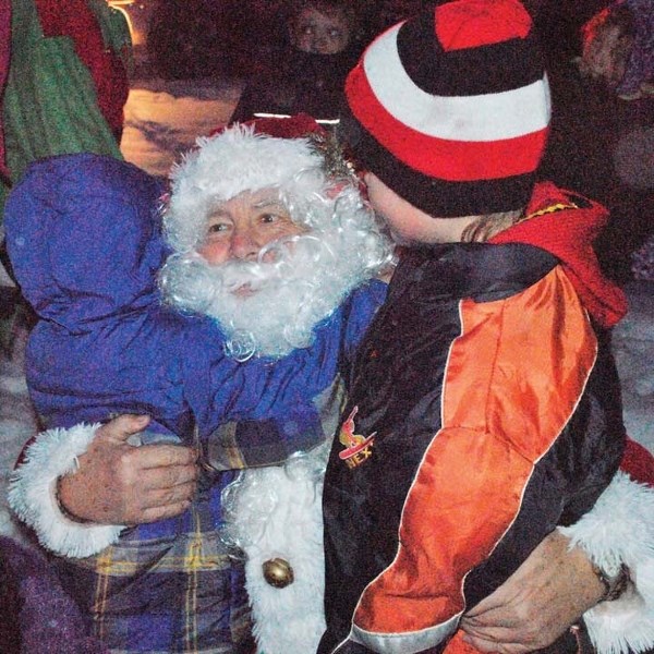 Santa Claus is surrounded by children after arriving at the ball diamonds as part of the annual Sundown in Sundre event last year. He is scheduled to return for another visit 