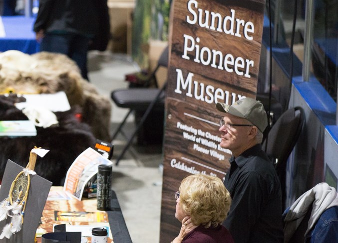 Sundre &amp; District Museum Society members man a booth at Neighbours&#8217; Day