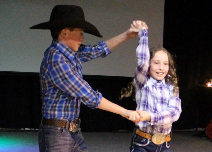  Colt Calvert and Teagen Peacock share a dance during the Miss Rodeo Sundre Fashion Show held Saturday evening at the West Country Centre.