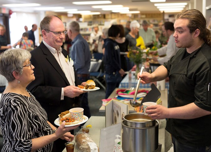  Markus Ross, right, serves cabbage borscht to Pauline and Stan McNutt.