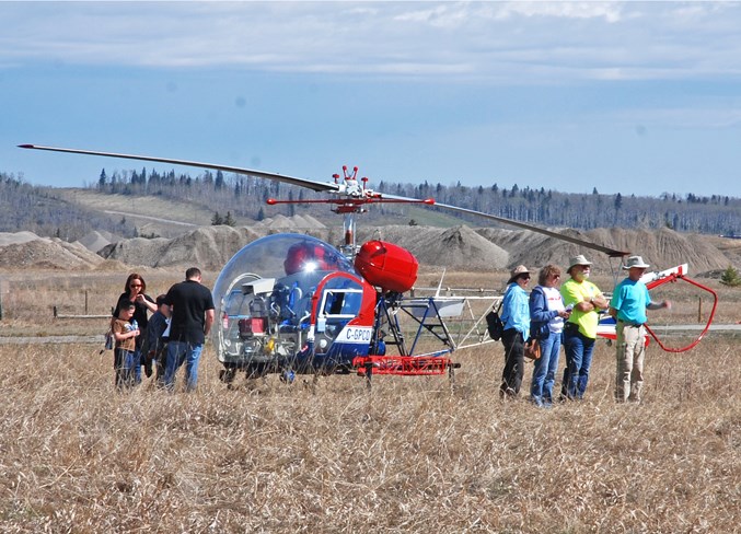  The Bell helicopter, a model made famous by the television series MASH, drew many visitors, who in turn watched as aircraft landed and departed.