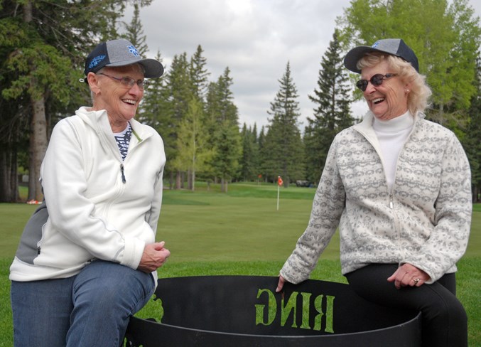  Leona Konschuh, left, the mother of the late Wade Konschuh, shared a laugh on Friday, May 24 with Sharon Skaley, the mother of Bev Konschuh, at the Sundre Golf Club during the second annual memorial golf tournament fundraiser in Wade’s honour.