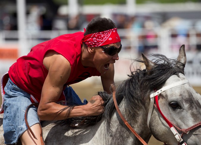 A competitor takes off from the arena during the Indian relay race.