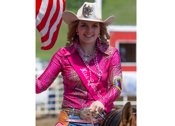  Miss Rodeo Sundre Mackenzie Skeels rides around the arena during the singing of the America National Anthem at the start of the 40th annual Sundre Pro Rodeo’s Saturday afternoon performance.