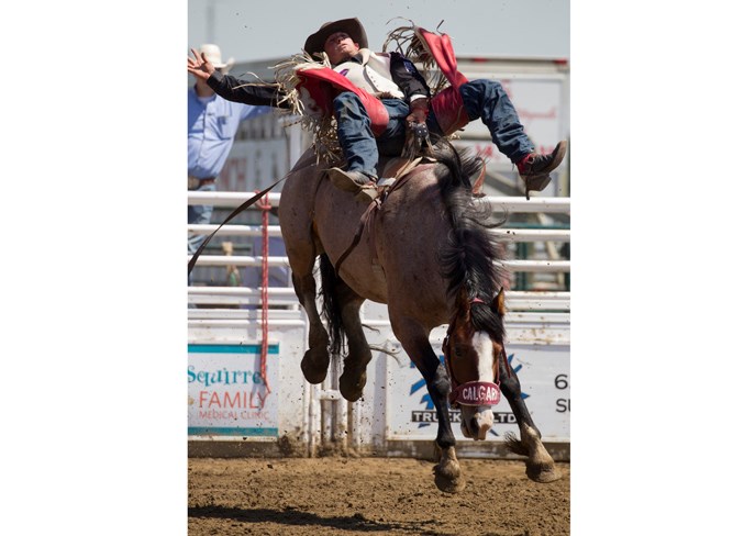  Ky Marshalll competes in bareback at the rodeo.