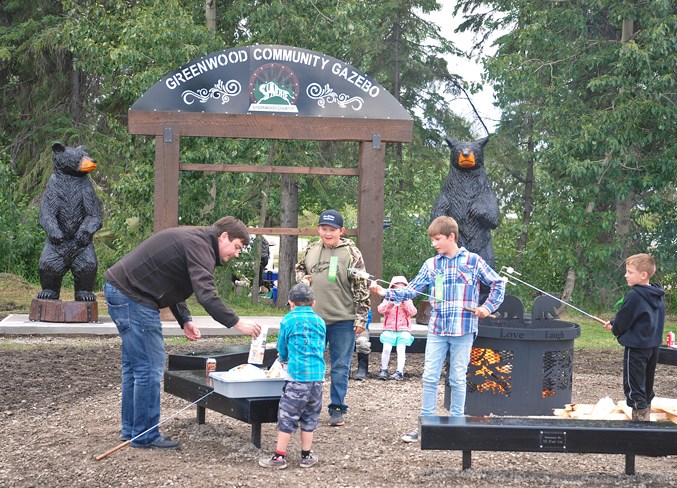  Several dozen people attended the gazebo’s ribbon cutting ceremony, which included a barbecue and some marshmallows for fires that were burning in brand new artisanal steel ring pits.