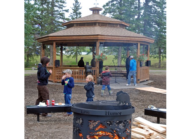  Two artisanal steel fire pits surrounded by benches were included near the gazebo, which stands completed in the background.