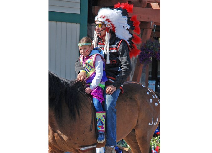  Members of the Canadian Indian Relay Racing Association dressed in traditional colourful garb.