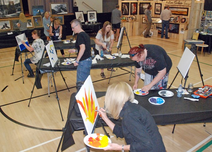  Six artists had 30 minutes to complete a painting, after which the viewing public voted for their favourite piece. A silent auction for the paintings raised funds for the Mountain View Food Bank.