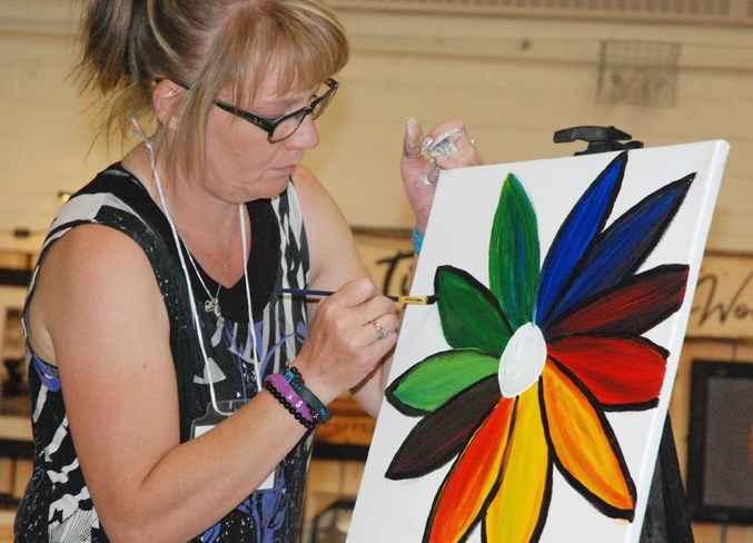  Melany Sealy, the event's organizer, was among the artists to participate in the live painting competition.