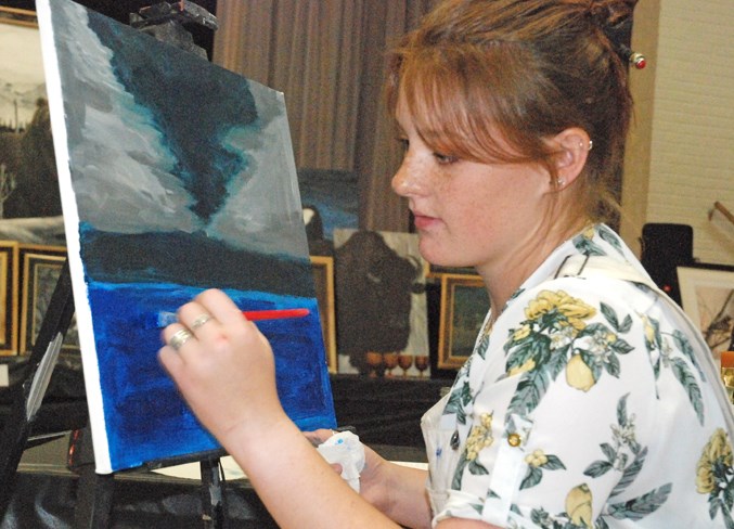  Hannah Larson, who last year graduated from Sundre High School, participated in her first live painting competition.