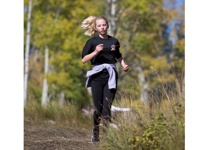  Sundre High School student Zoe Davidson runs along a trail on Snake Hill during the event.