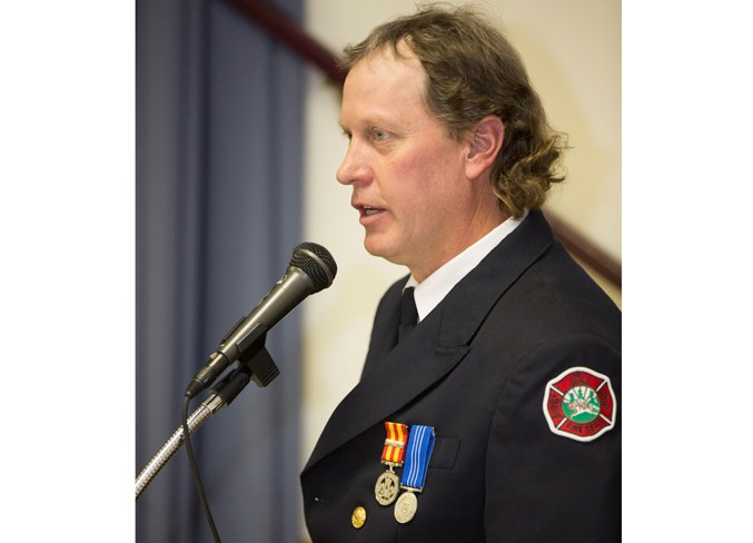  Sundre fire Chief Marty Butts addresses the crowd during the event.