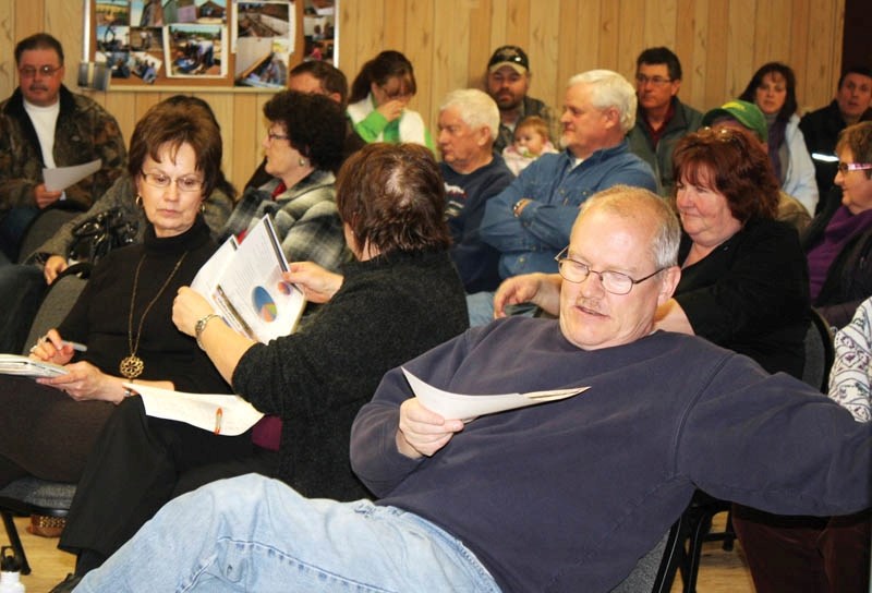Red Deer County residents peruse literature at last Thursday&#8217;s town hall.