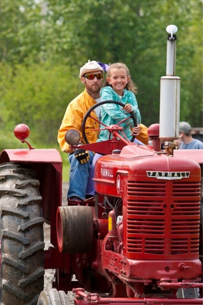 Ron and Grace Miller take part in a tractor parade at the Markerville Pioneer Days festivities on June 26.