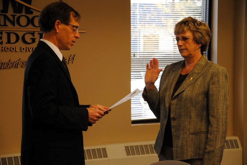 Chinook&#8217;s Edge School Division associate superintendent Allan Tarnoczi swears in Colleen Butler as chair of the Board of Education.