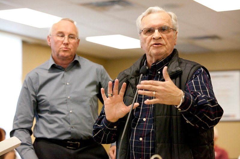 Neuroese planner Greg Brown (left) and agent Herb Styles appear before council&#8217;s policies and priorities committee last Wednesday.