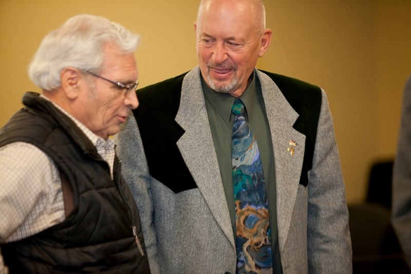 Herb Styles and Reeve Bruce Beattie talk during a break in Wednesday&#8217;s council meeting.