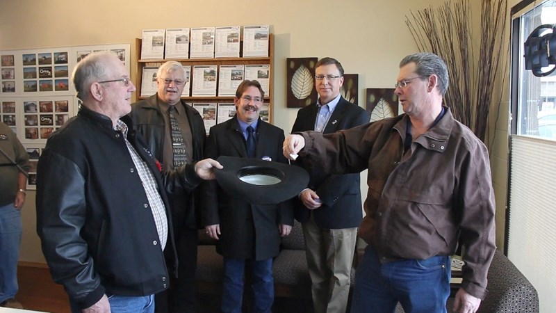 PC constituency association president Dave Hogarth (right) draws candidates&#8217; names for the order on the ballot following the filing deadline on Nov. 12