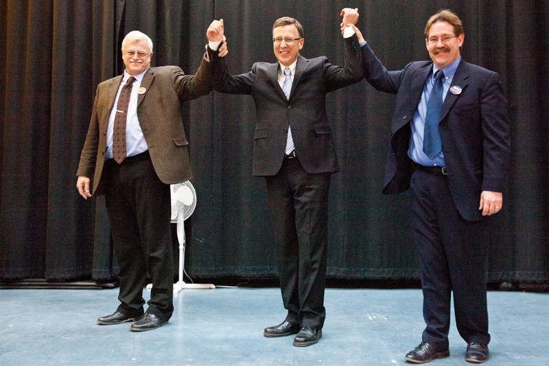 Darcy Davis in his moment of triumph with contenders Al Kemmere (left) and William Stevenson (right).