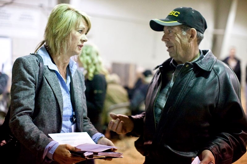 Environment and Water Minister Diana McQueen hears concerns expressed by one of about 220 participants at the Alberta Property Rights Task Force open house at the Cow Palace