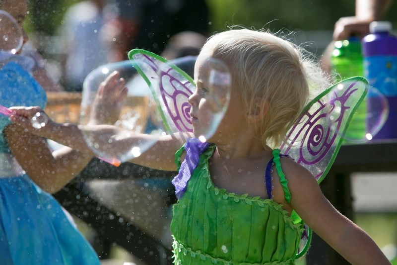 Edi Thomson makes bubbles during Water Valley Days.