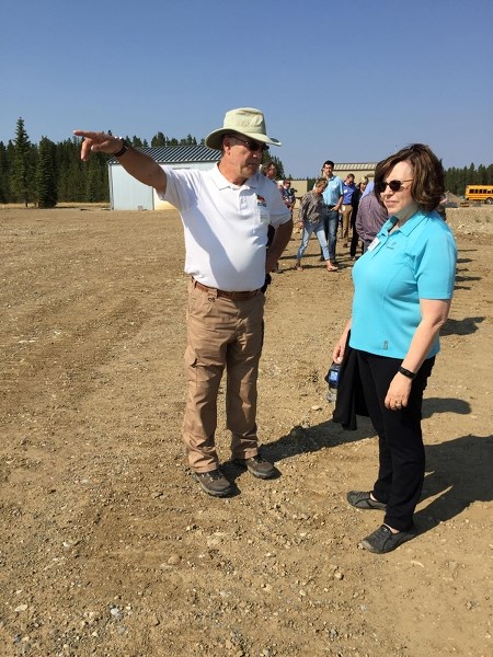 Search and Rescue training officer Richard Smith, left, speaks with Shell&#8217;s Alice Murray during a tour of the former Burnt Timber gas plant site northwest of Cremona.